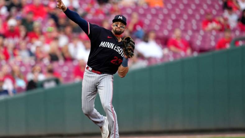 Minnesota Twins third baseman Royce Lewis (23) throws to first base for an out in the first inning of a baseball game against the Cincinnati Reds, Tuesday, Sept. 19, 2023, at Great American Ball Park in Cincinnati.