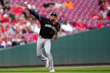 Minnesota Twins third baseman Royce Lewis (23) throws to first base for an out in the first inning of a baseball game against the Cincinnati Reds, Tuesday, Sept. 19, 2023, at Great American Ball Park in Cincinnati.