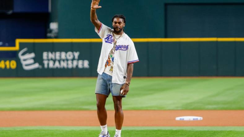 Sep 19, 2023; Arlington, Texas, USA;  Dallas Cowboys cornerback Trevon Diggs throws out the first pitch prior to the game between the Boston Red Sox and Texas Rangers at Globe Life Field. Mandatory Credit: Andrew Dieb-USA TODAY Sports