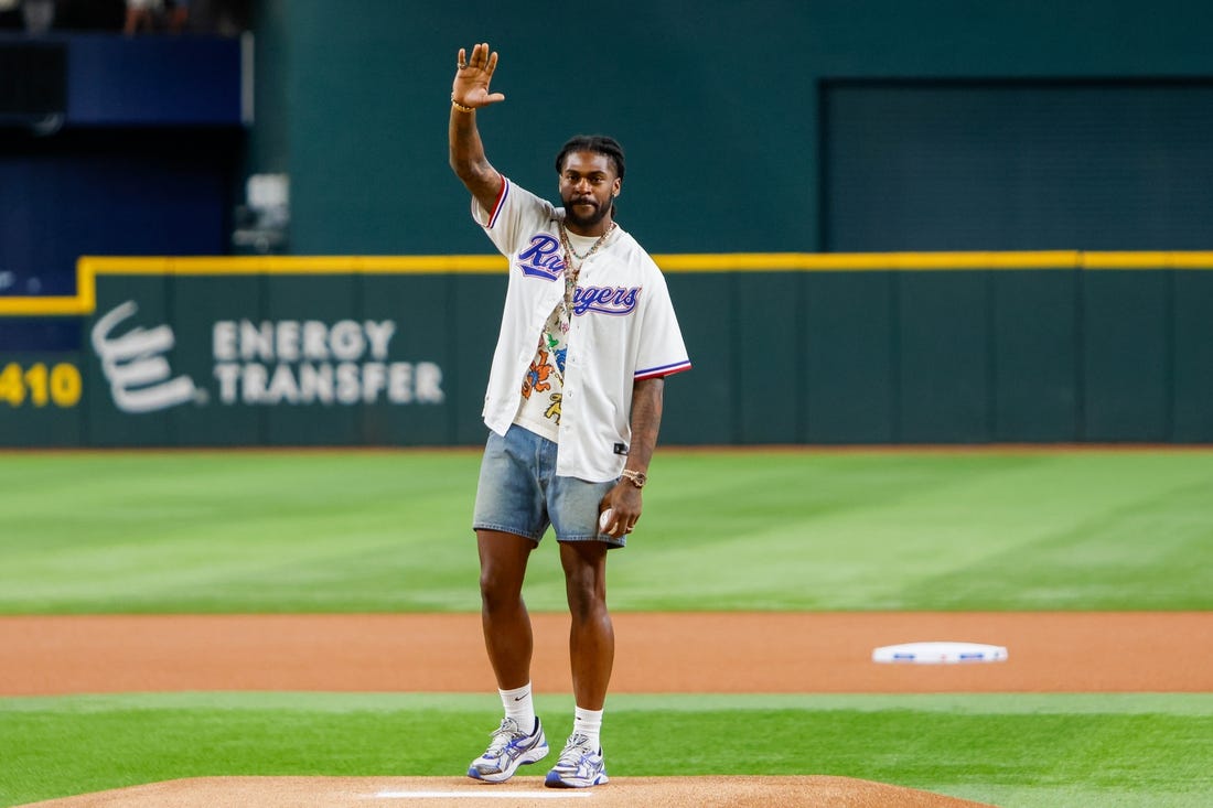 Sep 19, 2023; Arlington, Texas, USA;  Dallas Cowboys cornerback Trevon Diggs throws out the first pitch prior to the game between the Boston Red Sox and Texas Rangers at Globe Life Field. Mandatory Credit: Andrew Dieb-USA TODAY Sports