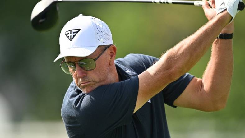 Sep 22, 2023; Sugar Grove, Illinois, USA; Phil Mickelson hits balls on the range during the first round of the LIV Golf Chicago golf tournament at Rich Harvest Farms. Mandatory Credit: Jamie Sabau-USA TODAY Sports