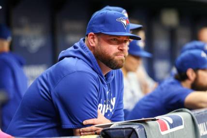 Sep 23, 2023; St. Petersburg, Florida, USA; Toronto Blue Jays manager John Schneider (14) looks on from the dugout against the Tampa Bay Rays in the eighth inning at Tropicana Field. Mandatory Credit: Nathan Ray Seebeck-USA TODAY Sports