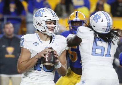 Sep 23, 2023; Pittsburgh, Pennsylvania, USA; North Carolina Tar Heels quarterback Drake Maye (10) looks to pass against the Pittsburgh Panthers during the first quarter at Acrisure Stadium. Mandatory Credit: Charles LeClaire-USA TODAY Sports