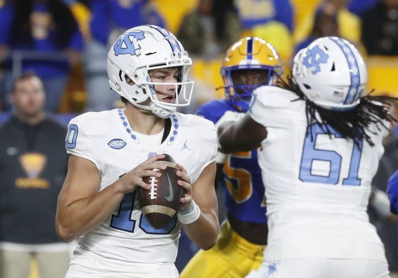Sep 23, 2023; Pittsburgh, Pennsylvania, USA; North Carolina Tar Heels quarterback Drake Maye (10) looks to pass against the Pittsburgh Panthers during the first quarter at Acrisure Stadium. Mandatory Credit: Charles LeClaire-USA TODAY Sports