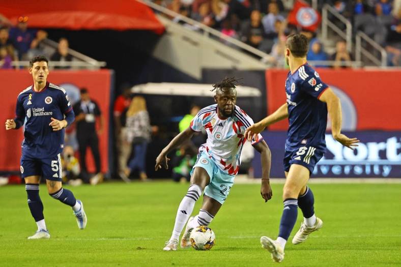 Sep 23, 2023; Chicago, Illinois, USA; Chicago Fire forward Kei Kamara (23) dribbles the ball against the New England Revolution during the first half at Soldier Field. Mandatory Credit: Mike Dinovo-USA TODAY Sports