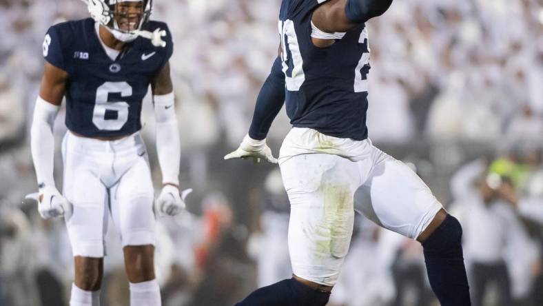 Penn State's Adisa Isaac celebrates after recovering a fumble during a White Out football game against Iowa Saturday, Sept. 23, 2023, in State College, Pa. The Nittany Lions shut out the Hawkeyes, 31-0.