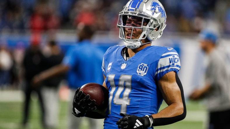 Detroit Lions wide receiver Amon-Ra St. Brown (14) warms up before the Atlanta Falcons game at Ford Field in Detroit on Sunday, Sept. 24, 2023.