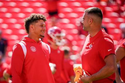 Sep 24, 2023; Kansas City, Missouri, USA; Kansas City Chiefs quarterback Patrick Mahomes (15) laughs with tight end Travis Kelce (87) against the Chicago Bears prior to a game at GEHA Field at Arrowhead Stadium. Mandatory Credit: Denny Medley-USA TODAY Sports