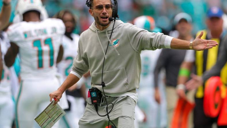 Sep 24, 2023; Miami Gardens, Florida, USA;  Miami Dolphins head coach Mike McDaniel signals to his team against the Denver Broncos in the fourth quarter at Hard Rock Stadium. Mandatory Credit: Nathan Ray Seebeck-USA TODAY Sports