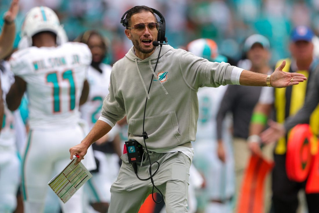 Sep 24, 2023; Miami Gardens, Florida, USA;  Miami Dolphins head coach Mike McDaniel signals to his team against the Denver Broncos in the fourth quarter at Hard Rock Stadium. Mandatory Credit: Nathan Ray Seebeck-USA TODAY Sports