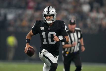 Sep 24, 2023; Paradise, Nevada, USA; Las Vegas Raiders quarterback Jimmy Garoppolo (10) carries the ball against the Pittsburgh Steelers in the second half at Allegiant Stadium. Mandatory Credit: Kirby Lee-USA TODAY Sports