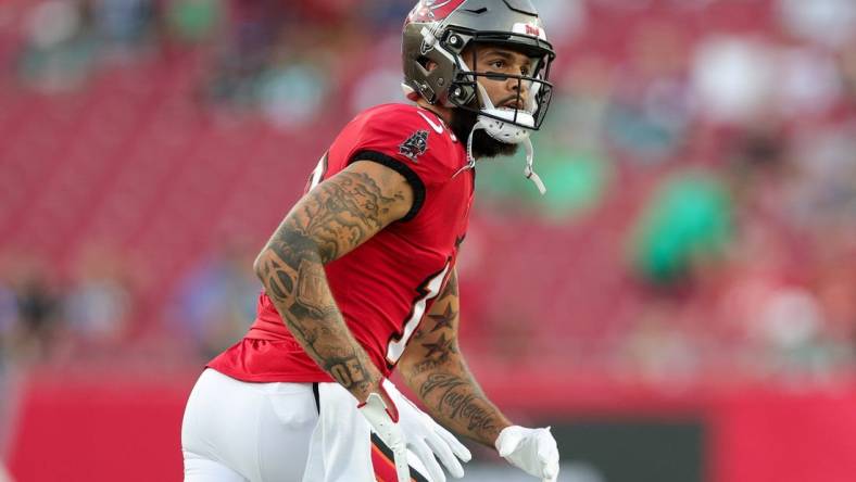 Sep 25, 2023; Tampa, Florida, USA;  Tampa Bay Buccaneers wide receiver Mike Evans (13) warms up before a game against the Philadelphia Eagles at Raymond James Stadium. Mandatory Credit: Nathan Ray Seebeck-USA TODAY Sports