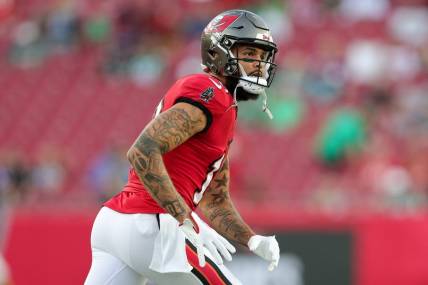 Sep 25, 2023; Tampa, Florida, USA;  Tampa Bay Buccaneers wide receiver Mike Evans (13) warms up before a game against the Philadelphia Eagles at Raymond James Stadium. Mandatory Credit: Nathan Ray Seebeck-USA TODAY Sports