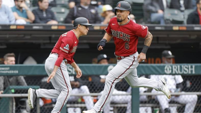 Sep 27, 2023; Chicago, Illinois, USA; Arizona Diamondbacks third baseman Jace Peterson (6) runs to score against the Chicago White Sox during the third inning at Guaranteed Rate Field. Mandatory Credit: Kamil Krzaczynski-USA TODAY Sports