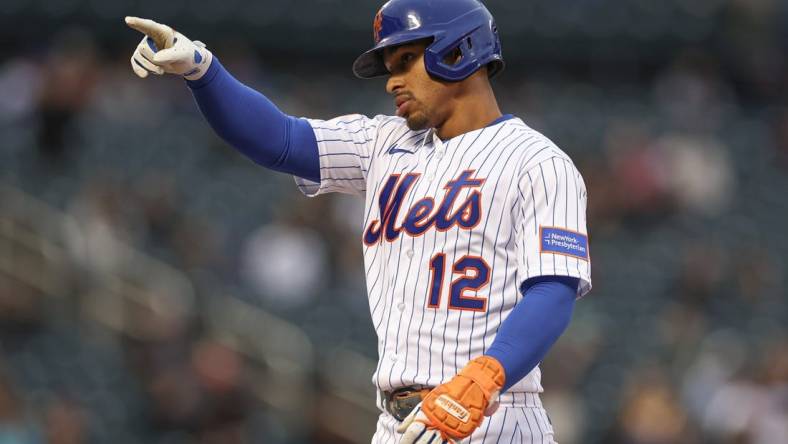 Sep 27, 2023; New York City, New York, USA; New York Mets shortstop Francisco Lindor (12) reacts after two RBI single during the seventh inning against the Miami Marlins at Citi Field. Mandatory Credit: Vincent Carchietta-USA TODAY Sports