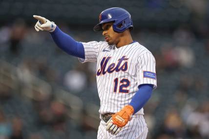 Sep 27, 2023; New York City, New York, USA; New York Mets shortstop Francisco Lindor (12) reacts after two RBI single during the seventh inning against the Miami Marlins at Citi Field. Mandatory Credit: Vincent Carchietta-USA TODAY Sports