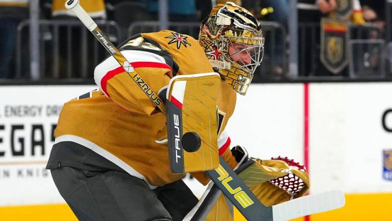 Sep 27, 2023; Las Vegas, Nevada, USA; Vegas Golden Knights goaltender Adin Hill (33) warms up before a preseason game against the Los Angeles Kings at T-Mobile Arena. Mandatory Credit: Stephen R. Sylvanie-USA TODAY Sports