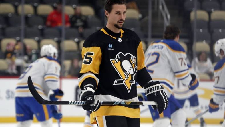 Sep 28, 2023; Pittsburgh, Pennsylvania, USA; Pittsburgh Penguins defenseman Erik Karlsson (65) warms up before the game against the Buffalo Sabres at PPG Paints Arena. Mandatory Credit: Charles LeClaire-USA TODAY Sports