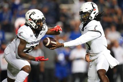 Cincinnati Bearcats quarterback Emory Jones (5) Cincinnati Bearcats running back Corey Kiner (21) in the first quarter during a college football game between the Brigham Young Cougars and the Cincinnati Bearcats, Friday, Sept. 29, 2023, at LaVell Edwards Stadium in Provo, Utah.