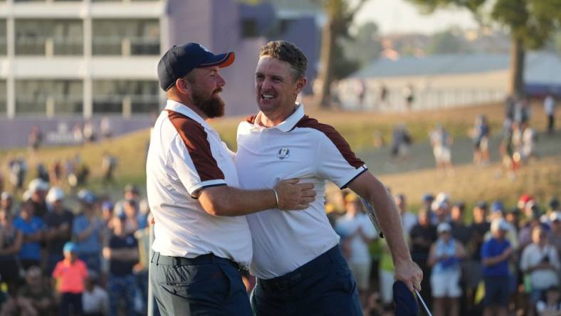 Sep 30, 2023; Rome, ITALY;  Team Europe golfer Shane Lowry and Team Europe golfer Justin Rose celebrate on the 16th hole during day two fourballs round for the 44th Ryder Cup golf competition at Marco Simone Golf and Country Club. Mandatory Credit: Kyle Terada-USA TODAY Sports