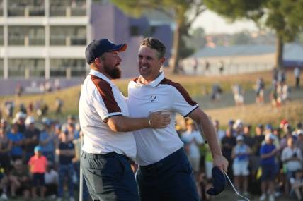 Sep 30, 2023; Rome, ITALY;  Team Europe golfer Shane Lowry and Team Europe golfer Justin Rose celebrate on the 16th hole during day two fourballs round for the 44th Ryder Cup golf competition at Marco Simone Golf and Country Club. Mandatory Credit: Kyle Terada-USA TODAY Sports