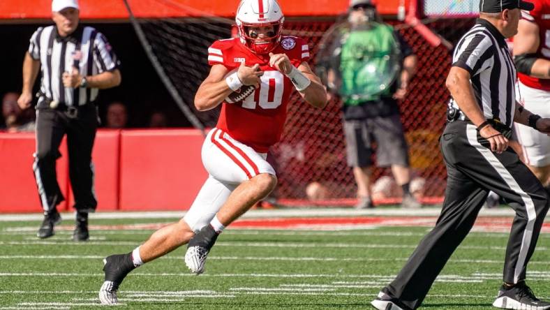 Sep 30, 2023; Lincoln, Nebraska, USA; Nebraska Cornhuskers quarterback Heinrich Haarberg (10) runs against the Michigan Wolverines during the second quarter at Memorial Stadium. Mandatory Credit: Dylan Widger-USA TODAY Sports