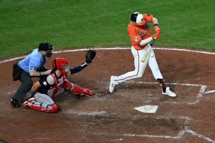 Sep 30, 2023; Baltimore, Maryland, USA;  Baltimore Orioles first baseman Ryan Mountcastle (6) hits a rbi double scoring  shortstop Jorge Mateo (3) in the seventh inning at Oriole Park at Camden Yards. Mandatory Credit: Tommy Gilligan-USA TODAY Sports