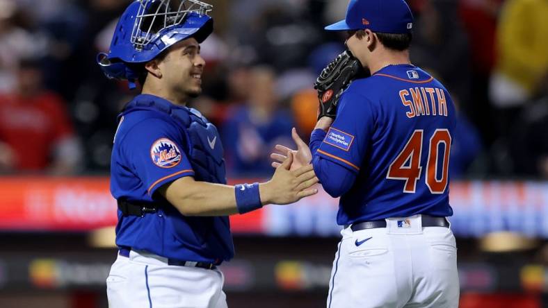 Sep 30, 2023; New York City, New York, USA; New York Mets catcher Francisco Alvarez (4) celebrates with relief pitcher Drew Smith (40) after defeating the Philadelphia Phillies at Citi Field. Mandatory Credit: Brad Penner-USA TODAY Sports