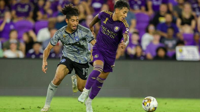 Sep 30, 2023; Orlando, Florida, USA;  Orlando City SC forward Facundo Torres (17) controls the ball from CF Montreal midfielder Nathan-Dylan Saliba (19) in the second half at Exploria Stadium. Mandatory Credit: Nathan Ray Seebeck-USA TODAY Sports