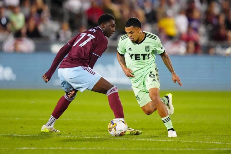 Sep 30, 2023; Commerce City, Colorado, USA; Austin FC midfielder Daniel Pereira (6) steals the ball away from Colorado Rapids forward Darren Yapi (77) in the second half at Dick's Sporting Goods Park. Mandatory Credit: Ron Chenoy-USA TODAY Sports
