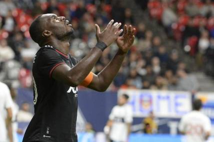 Sep 30, 2023; Vancouver, British Columbia, CAN;  D.C. United forward Christian Benteke (20) reacts during the second half against the Vancouver Whitecaps FC at BC Place. Mandatory Credit: Anne-Marie Sorvin-USA TODAY Sports