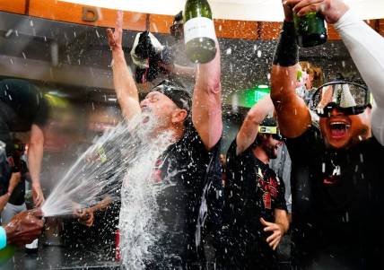 Sep 30, 2023; Phoenix, AZ, USA; Arizona Diamondbacks manager Torey Lovullo is sprayed with champagne during celebrations after clinching a wild card playoff spot following their game with the Houston Astros at Chase Field. Mandatory Credit: Rob Schumacher-Arizona Republic