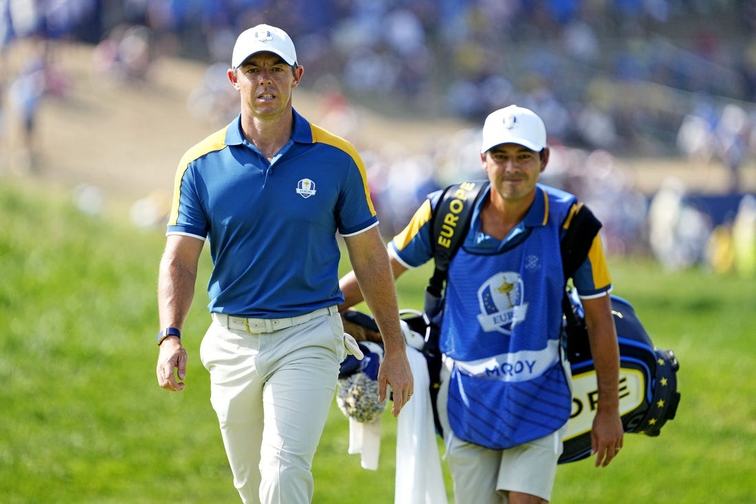 Oct 1, 2023; Rome, ITA; Team Europe golfer Rory McIlroy and his caddie Harry Diamond walk on on the first hole during the final day of the 44th Ryder Cup golf competition at Marco Simone Golf and Country Club. Mandatory Credit: Adam Cairns-USA TODAY Sports