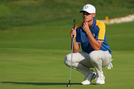 Oct 1, 2023; Rome, ITA; Team Europe golfer Ludvig Aberg lines up his putt on the 16th green during the final day of the 44th Ryder Cup golf competition at Marco Simone Golf and Country Club. Mandatory Credit: Kyle Terada-USA TODAY Sports