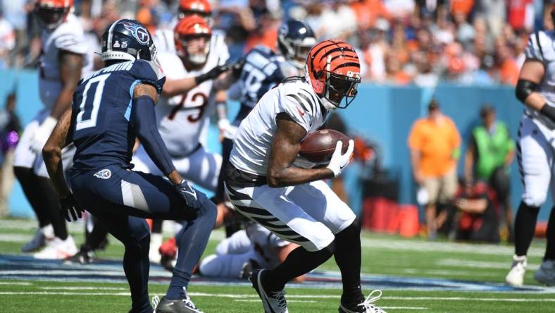 Oct 1, 2023; Nashville, Tennessee, USA; Cincinnati Bengals wide receiver Tee Higgins (5) runs after a catch during the first half against the Tennessee Titans at Nissan Stadium. Mandatory Credit: Christopher Hanewinckel-USA TODAY Sports