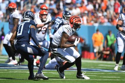 Oct 1, 2023; Nashville, Tennessee, USA; Cincinnati Bengals wide receiver Tee Higgins (5) runs after a catch during the first half against the Tennessee Titans at Nissan Stadium. Mandatory Credit: Christopher Hanewinckel-USA TODAY Sports