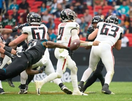 Oct 1, 2023; London, United Kingdom; Jacksonville Jaguars linebacker Josh Allen (41) pressures Atlanta Falcons quarterback Desmond Ridder (9) during the second half of an NFL International Series game at Wembley Stadium. Mandatory Credit: Peter van den Berg-USA TODAY Sports
