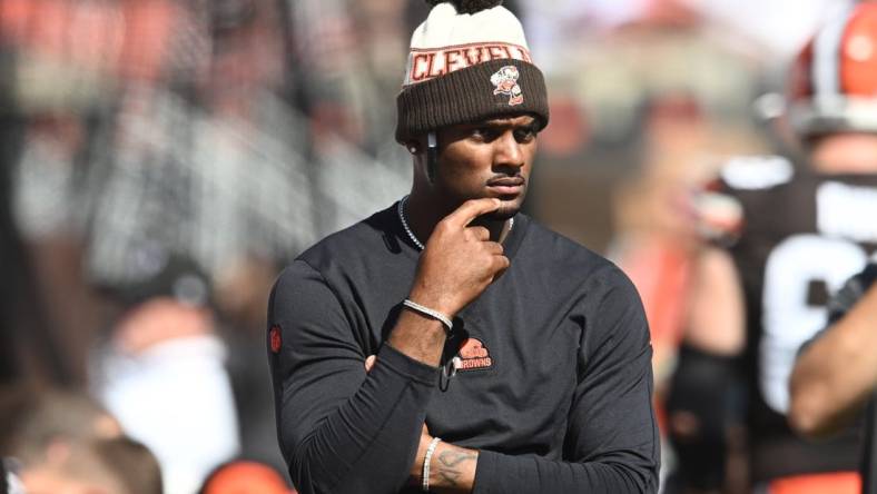 Oct 1, 2023; Cleveland, Ohio, USA; Cleveland Browns quarterback Deshaun Watson (4) watches from the sidelines during the first half against the Baltimore Ravens at Cleveland Browns Stadium. Mandatory Credit: Ken Blaze-USA TODAY Sports