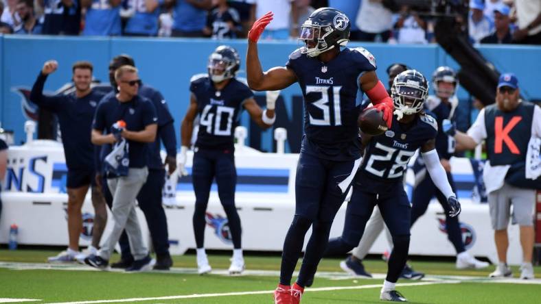 Oct 1, 2023; Nashville, Tennessee, USA; Tennessee Titans safety Kevin Byard (31) celebrates after recovering a fumble during the second half against the Cincinnati Bengals at Nissan Stadium. Mandatory Credit: Christopher Hanewinckel-USA TODAY Sports