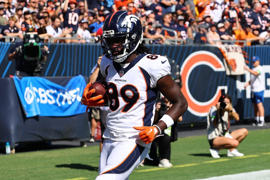 Oct 1, 2023; Chicago, Illinois, USA; Denver Broncos wide receiver Brandon Johnson (89) makes a touchdown catch against the Chicago Bears during the second half at Soldier Field. Mandatory Credit: Mike Dinovo-USA TODAY Sports