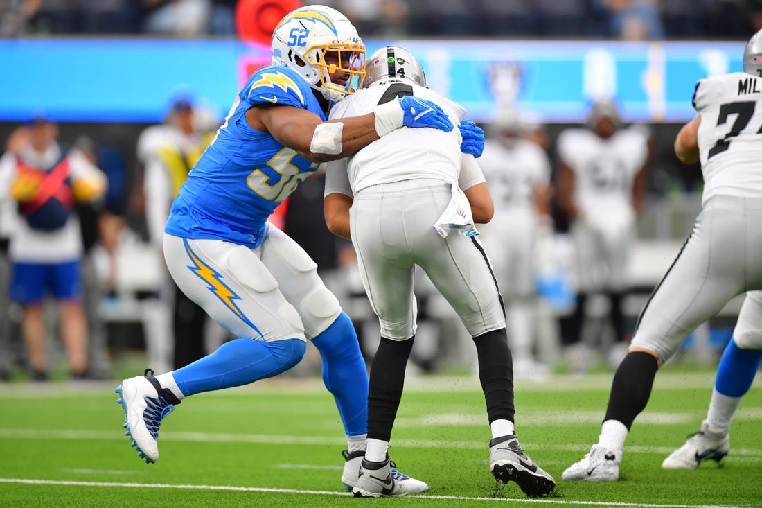 Oct 1, 2023; Inglewood, California, USA; Los Angeles Chargers linebacker Khalil Mack (52) sacks Las Vegas Raiders quarterback Aidan O'Connell (4) during the first half at SoFi Stadium. Mandatory Credit: Gary A. Vasquez-USA TODAY Sports