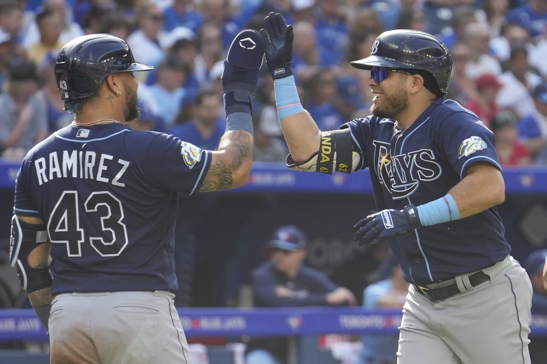 Oct 1, 2023; Toronto, Ontario, CAN; Tampa Bay Rays designated hitter Harold Ramirez (43) congratulates first baseman Jonathan Aranda (62) after his grandslam home run against the Toronto Blue Jays during the second inning at Rogers Centre. Mandatory Credit: John E. Sokolowski-USA TODAY Sports