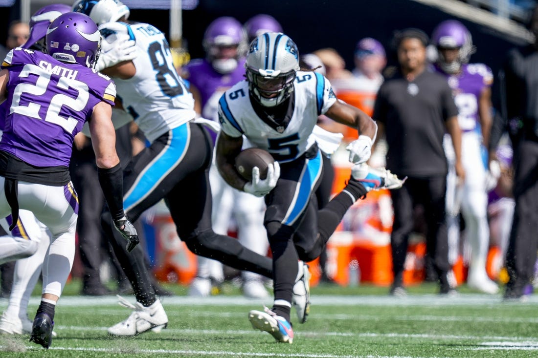 Oct 1, 2023; Charlotte, North Carolina, USA; Carolina Panthers wide receiver Laviska Shenault Jr. (5) runs for yards after catch against Minnesota Vikings safety Harrison Smith (22) during the second half at Bank of America Stadium. Mandatory Credit: Jim Dedmon-USA TODAY Sports