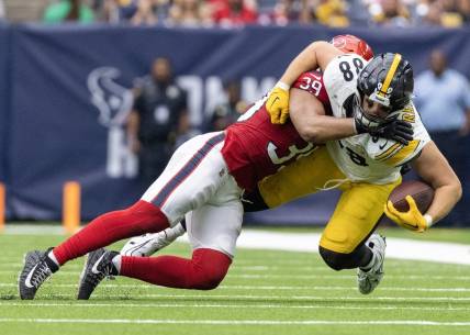 Oct 1, 2023; Houston, Texas, USA; Pittsburgh Steelers tight end Pat Freiermuth (88) is tackled by Houston Texans linebacker Henry To'oTo'o (39) in the second half at NRG Stadium. Mandatory Credit: Thomas Shea-USA TODAY Sports