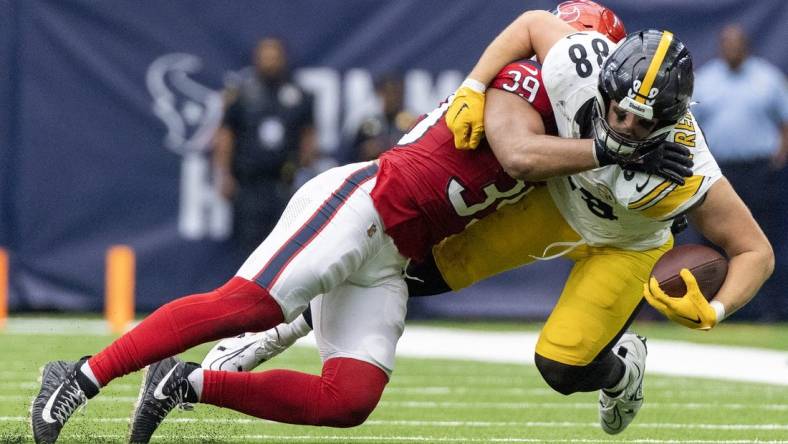 Oct 1, 2023; Houston, Texas, USA; Pittsburgh Steelers tight end Pat Freiermuth (88) is tackled by Houston Texans linebacker Henry To'oTo'o (39) in the second half at NRG Stadium. Mandatory Credit: Thomas Shea-USA TODAY Sports