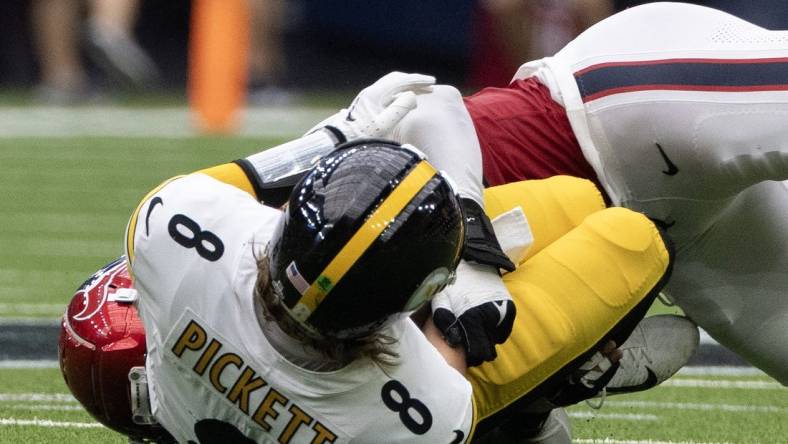 Oct 1, 2023; Houston, Texas, USA; Pittsburgh Steelers quarterback Kenny Pickett (8) is injured as he is sacked by Houston Texans defensive end Jonathan Greenard (52) in the second half at NRG Stadium. Mandatory Credit: Thomas Shea-USA TODAY Sports