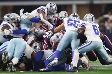 Oct 1, 2023; Arlington, Texas, USA; New England Patriots quarterback Mac Jones (10) is stopped short of a first down in the second quarter against the Dallas Cowboys at AT&T Stadium. Mandatory Credit: Tim Heitman-USA TODAY Sports