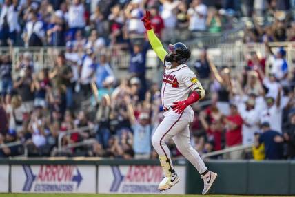 Oct 1, 2023; Cumberland, Georgia, USA; Atlanta Braves designated hitter Marcell Ozuna (20) reacts after hitting a home run against the Washington Nationals to tie the Major League team record for home runs hit in a season during the ninth inning at Truist Park. Mandatory Credit: Dale Zanine-USA TODAY Sports