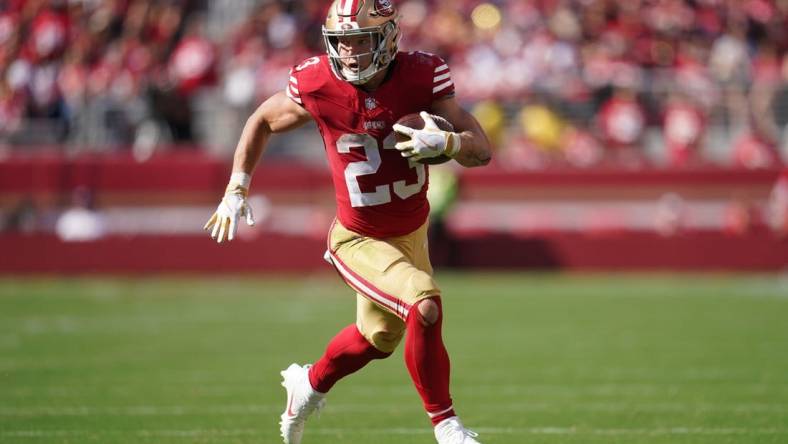 Oct 1, 2023; Santa Clara, California, USA; San Francisco 49ers running back Christian McCaffrey (23) runs the ball against the Arizona Cardinals in the third quarter at Levi's Stadium. Mandatory Credit: Cary Edmondson-USA TODAY Sports