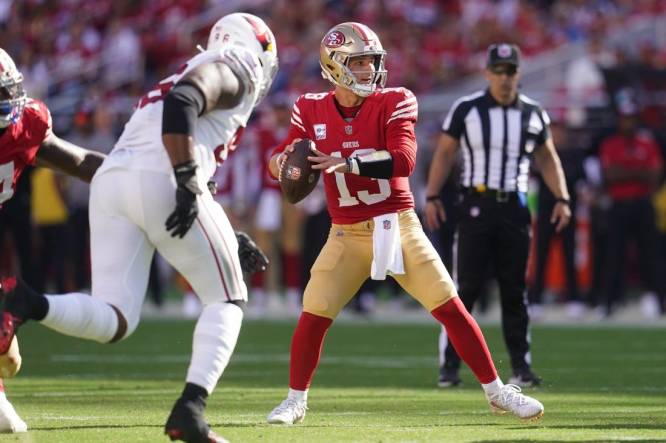 Christian McCaffrey scores 4 TDs to lead the 49ers past the Cardinals 35-16